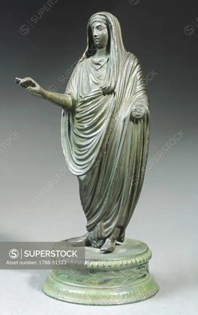 Clothed figure, bronze cast statue finished in bulino engraving, Emilia-Romagna, Italy. Italic Civilization, 1st Century.
