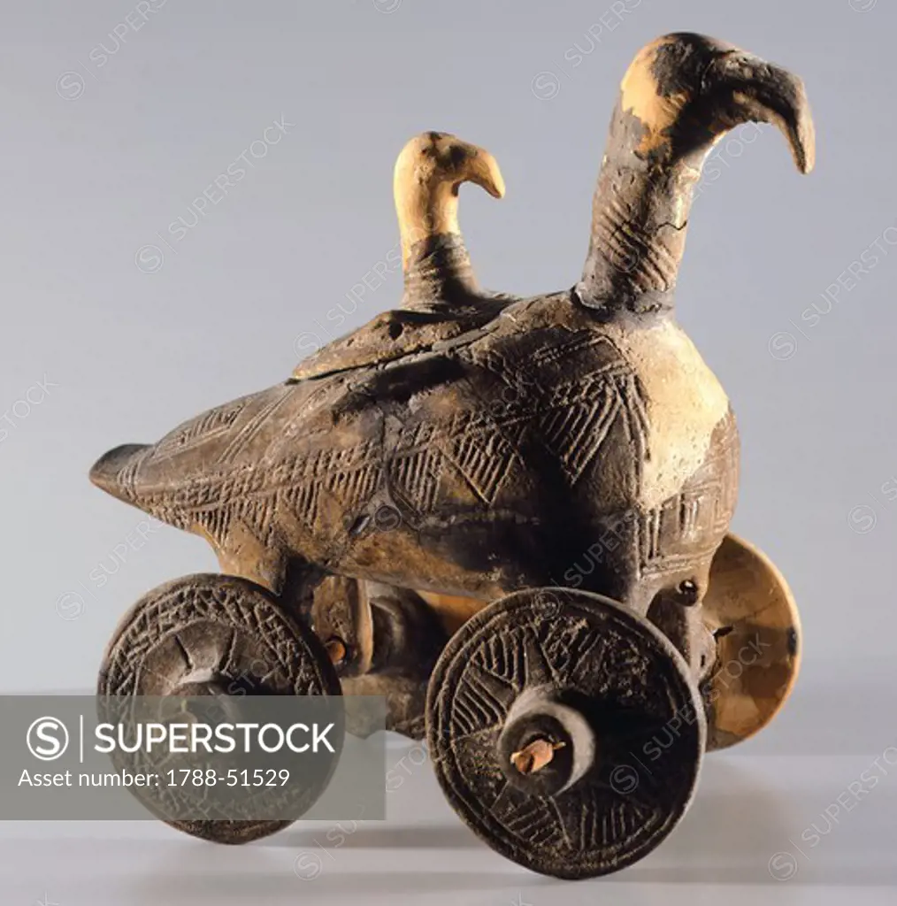 Goose-shaped vessel on wheels, with firmly-set geometric cord imprinted patterns, from Tomb 2 in the Pela' Necropolis of Este, Veneto, Italy. 21.5 cm high. Paleoveneti Civilization, 9th Century BC.