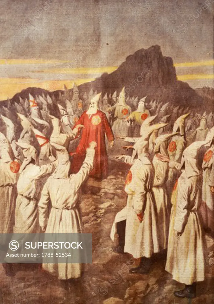 Ku Klux Klan meeting on the mountains of Georgia, 1920. Achille Beltrame (1871-1945), illustration from La domenica del Corriere. Racism, nineteenth-twentieth century United States.