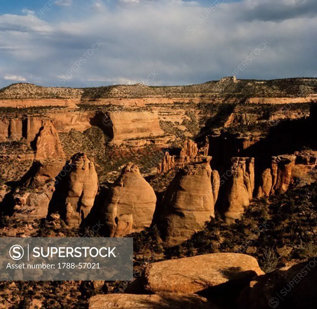 Rock monoliths and canyons in a semi-desert, Colorado National Monument, Colorado, United States.