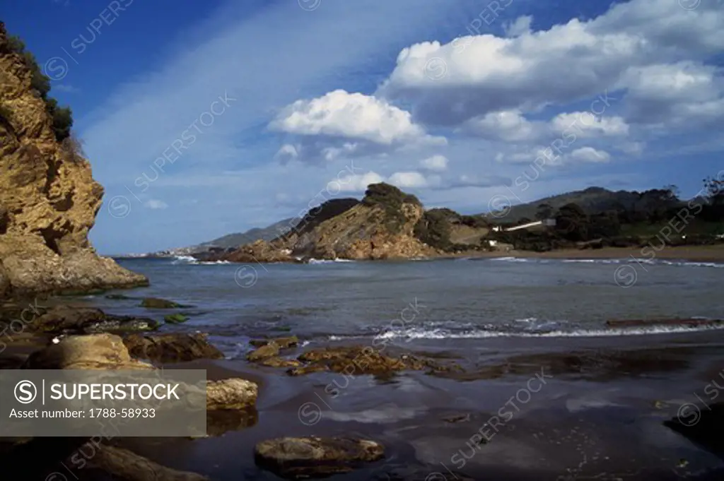 Sandy and rocky cove along the Dahra coast (Corniche des Dahra) between Cherchell and Gouraya, Algeria.
