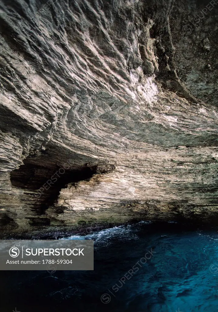 Sdragonato cave in the limestone cliff of Bonifacio, Corsica, France.