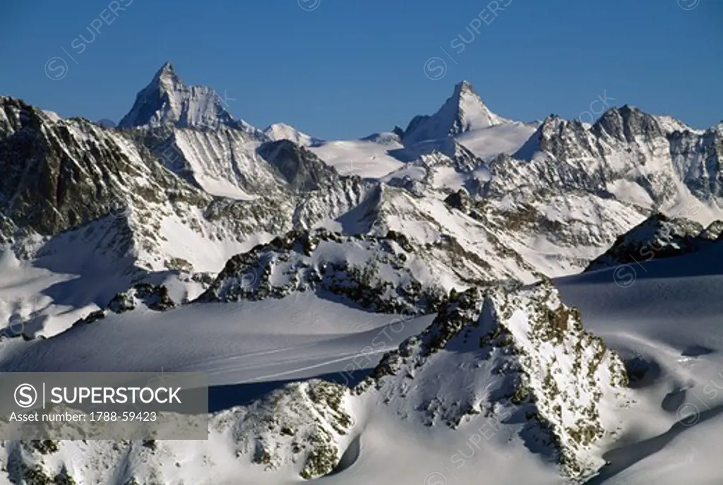 Dent d'Herens (4171 metres), left, and The Matterhorn (4478 metres), Canton of Valais, Switzerland.