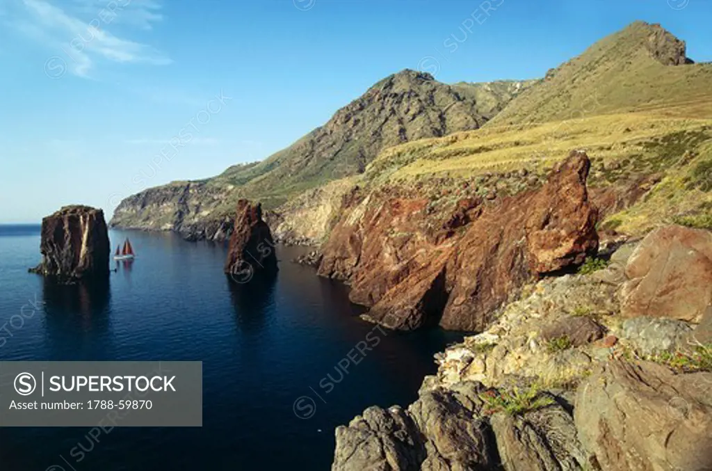 Rocky coastline and cliffs, island of Lipari, Aeolian Islands or Lipari (UNESCO World Heritage List, 2000), Sicily, Italy.
