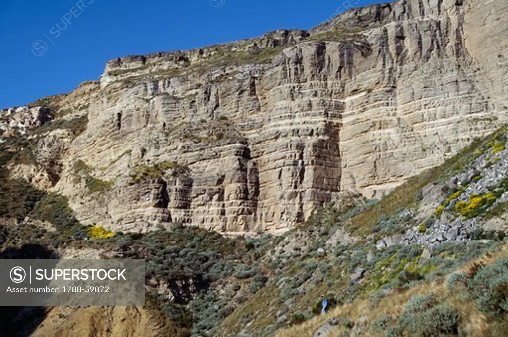 Sheer cliff walls in Caolino, island of Lipari, Aeolian Islands or Lipari (UNESCO World Heritage List, 2000), Sicily, Italy.