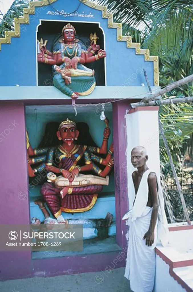 India - Tamil Nadu. Brahmin man in a small temple of Goddess Kali