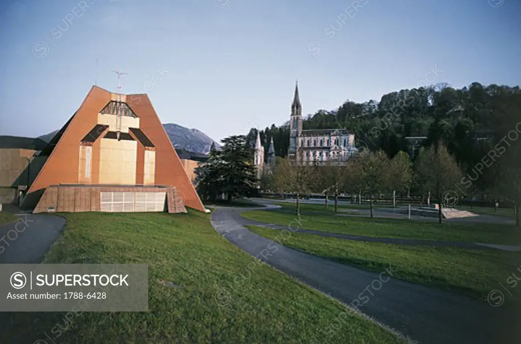 France - Lourdes. Saint Bernadette's church. In the background, Basilica of Our Lady of Lourdes