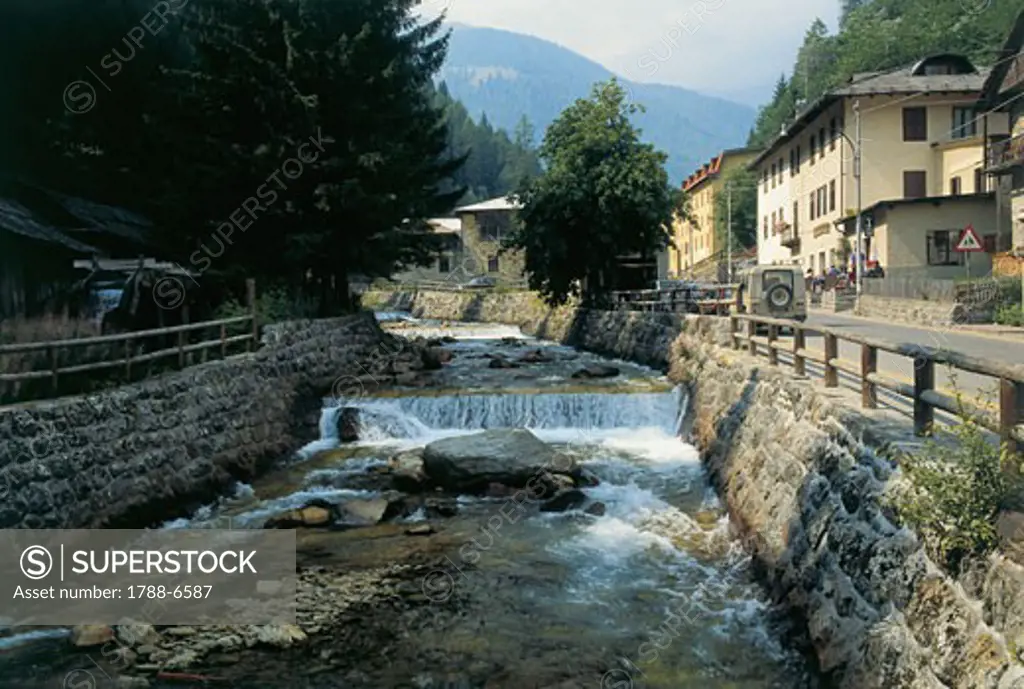 Stream flowing along a road, Sole Valley, Bagni Di Rabbi, Trentino, Italy