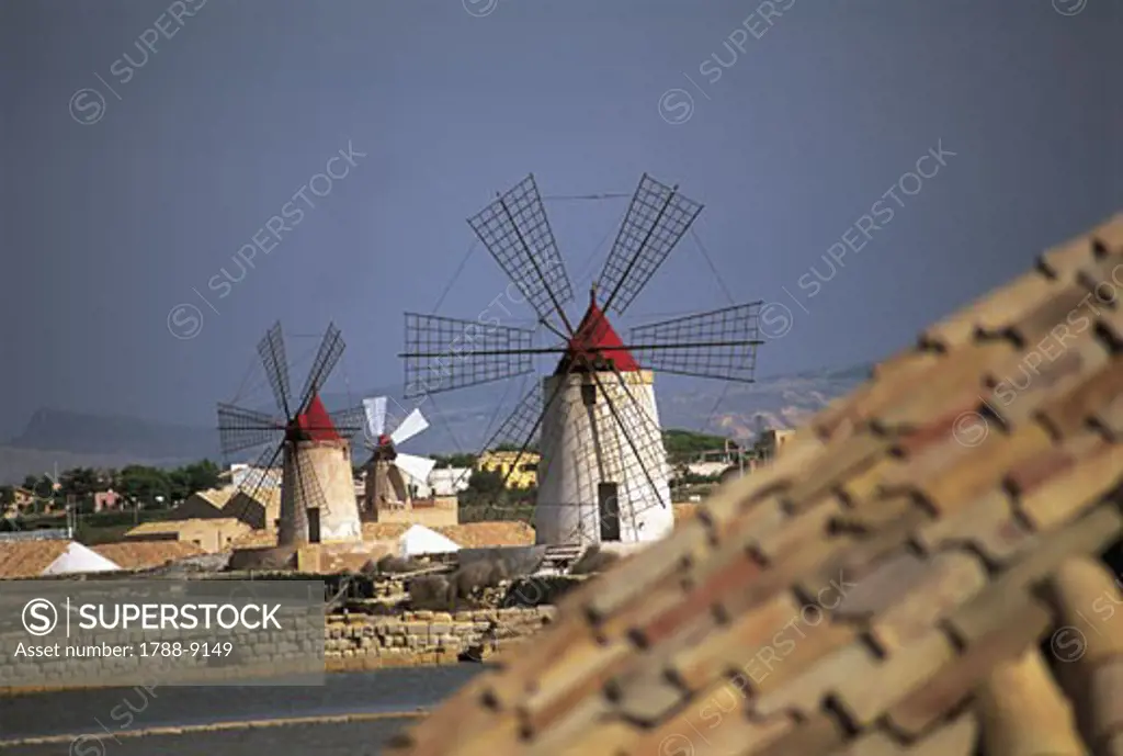 Traditional windmills in a town, Riserva Naturale integrale Saline Di Trapani E Paceco, Sicily, Italy