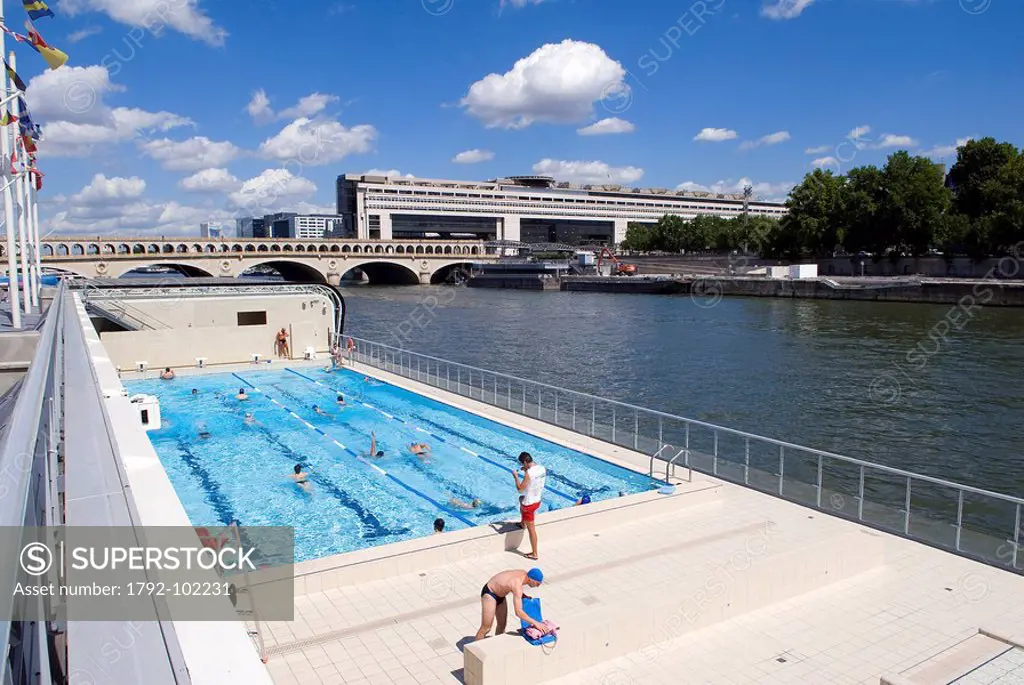 France, Paris, banks of the Seine river listed as World Heritage by UNESCO, the Josephine Baker swimming pool on the left and the Ministry of the Econ...