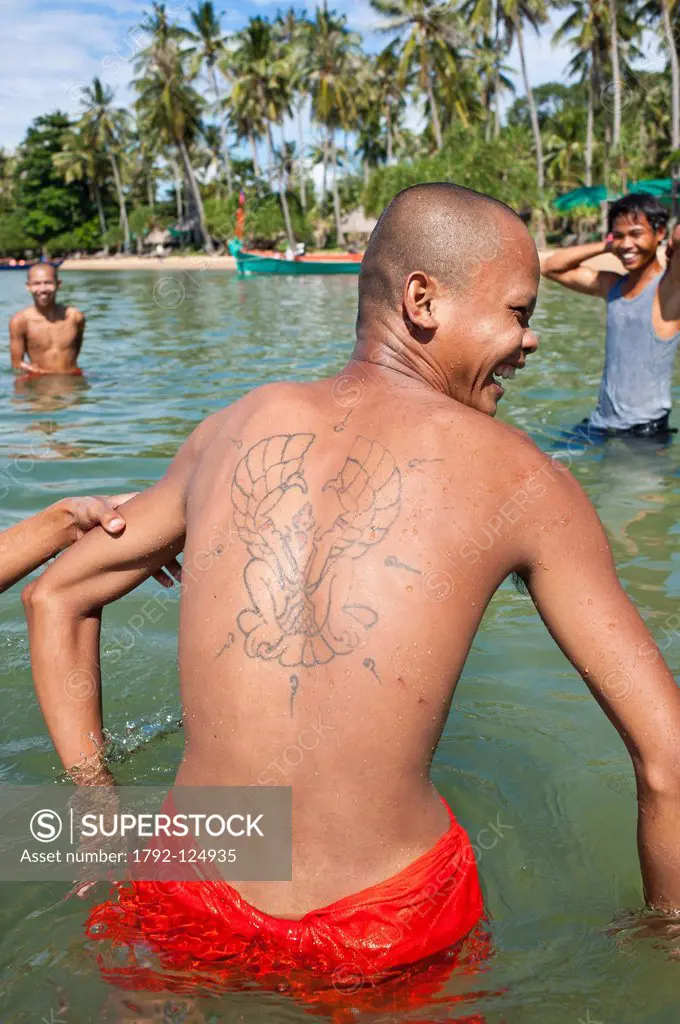 Cambodia, Kampot Province, Tonsay Island Island of Rabbits, Buddhist monks with a tattoo on his back during a visit of the island