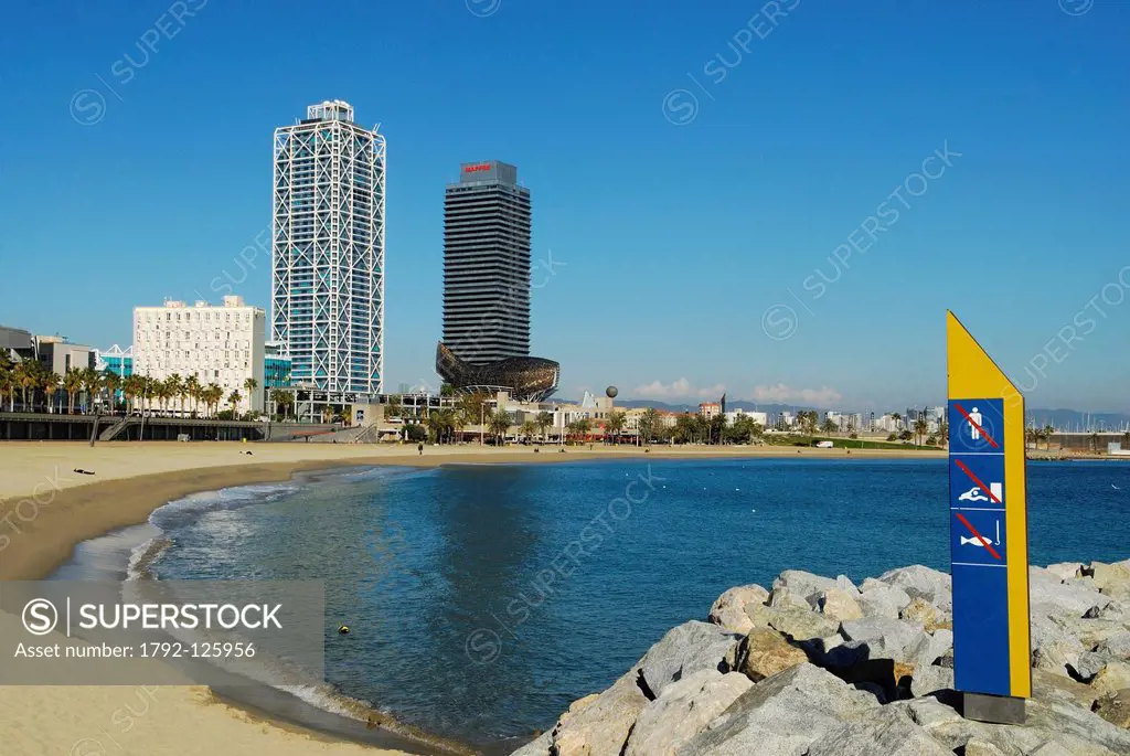 Spain, Catalonia, Barcelona, Barcelonata Beach, in the background the Peix or the Ballena Whale by Frank O. Gehry, the Hotel Arts and the Mapfre Insur...