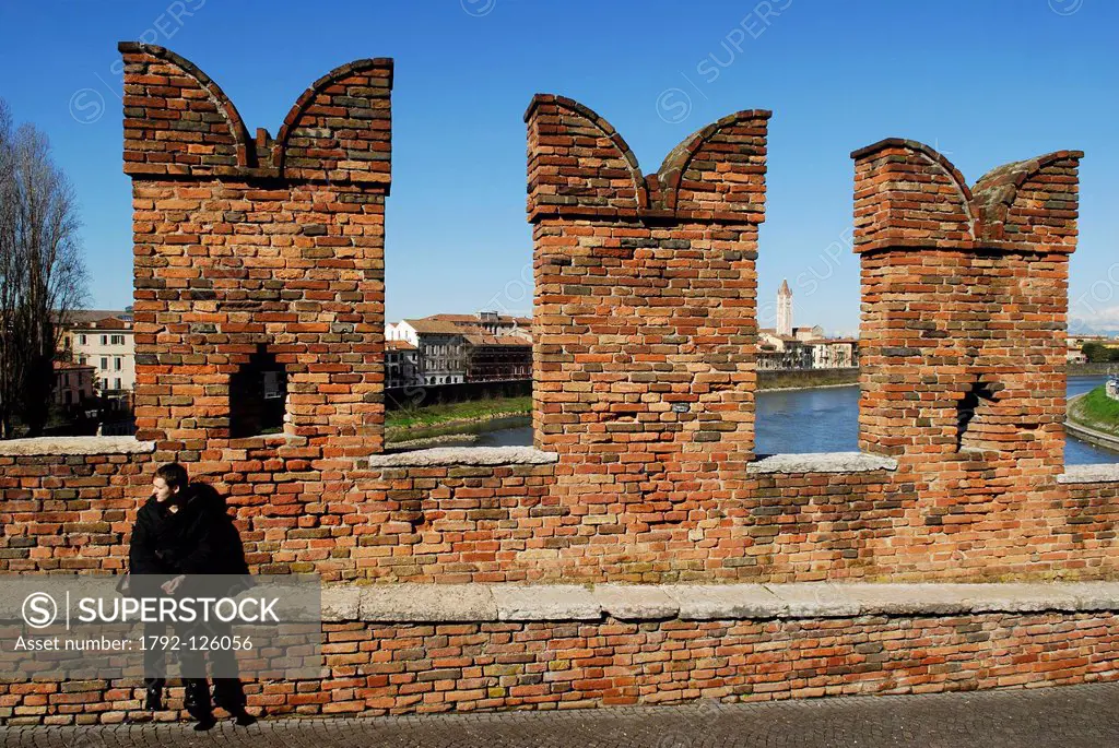 Italy, Veneto, Verona, listed as World Heritage by UNESCO, Scaliger Bridge ponte Scaligero, fortified bridge over the Adige River, in the background S...