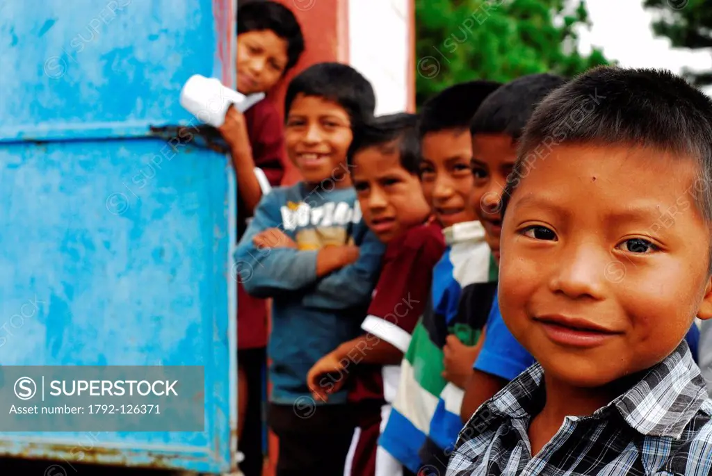 Guatemala, Aguacatan, schoolboys queuing in front of latrine, MR