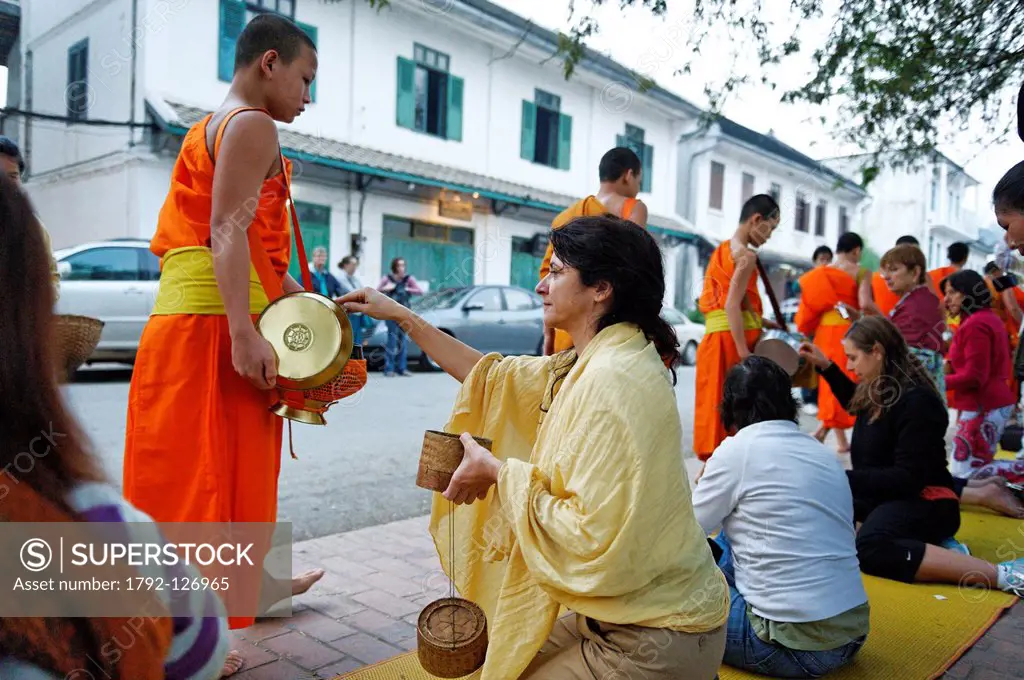 Laos, Luang Prabang Province, Luang Prabang City, listed as World Heritage by UNESCO, Tak Bat Ceremony of the offerings made to the monks eachvery mor...