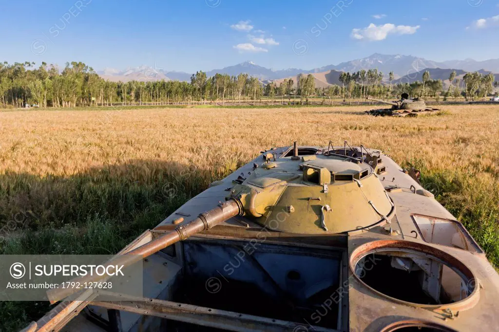 Afghanistan, Bamiyan province, Bamiyan, wreck of tank in a field