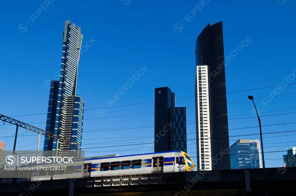 Australia, Victoria, Melbourne, downtown, buildings of Southbank on Yarra River and train on Flinders Street