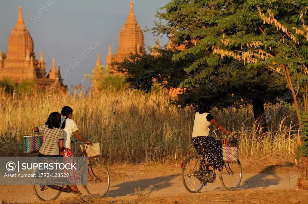 Myanmar Burma, Mandalay Division, Bagan Pagan, Old Bagan, young girls in bicycle