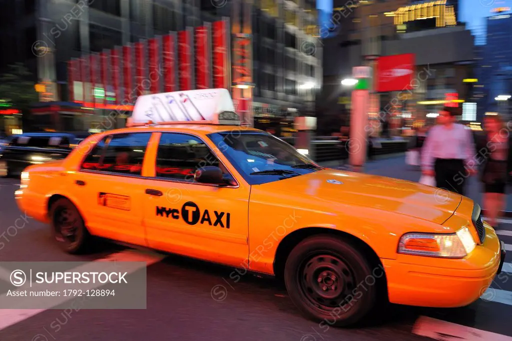 United States, New York City, Manhattan, Theater District on Broadway Avenue, yellow cab in Times Square