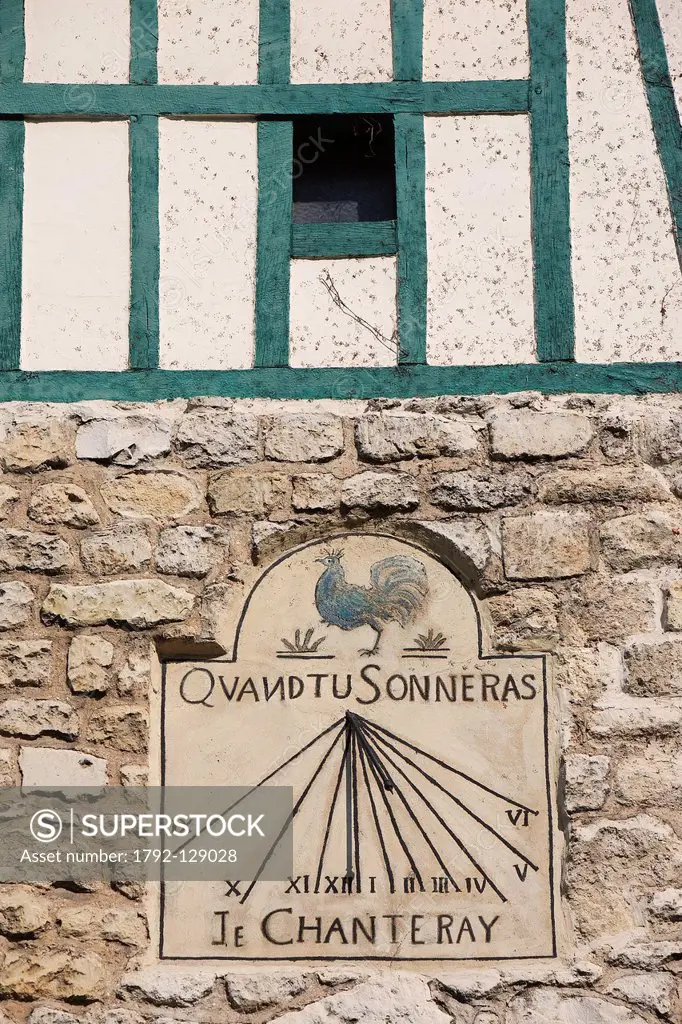 France, Paris, the Butte Montmartre, faade of a house and sundial located on Abreuvoir street