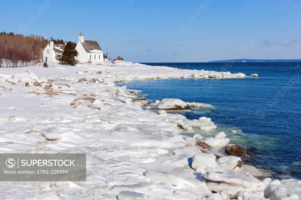 Canada, Quebec province, Charlevoix region, the St Lawrence River Road, Port au Persil, the little church on the edge of the frozen water in winter