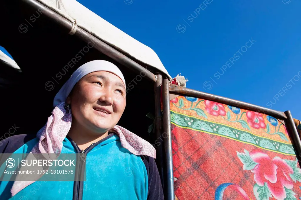 Kyrgyzstan, Naryn Province, Arpa valley, portrait of a woman in front of a yurt