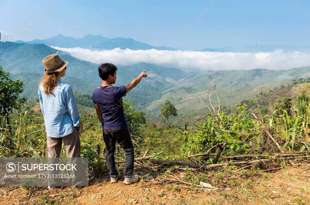 Laos, Oudomxay province, panoramic view over the mountains in the surroundings of Muang La village, with the local guide Bouliang