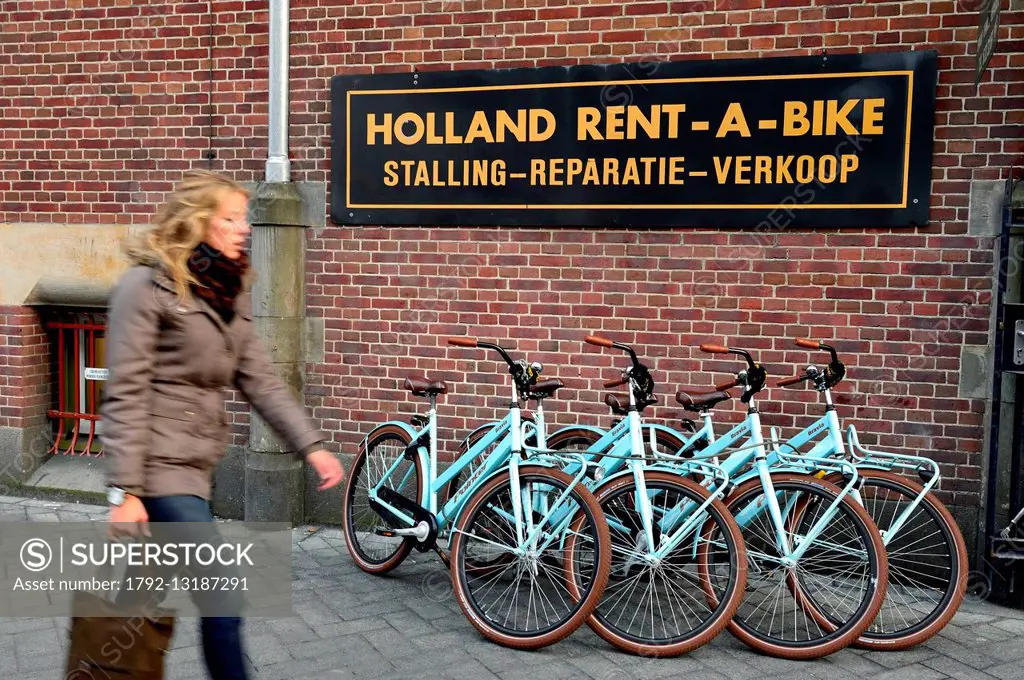 Netherlands, Amsterdam, Damrak, rent a bike