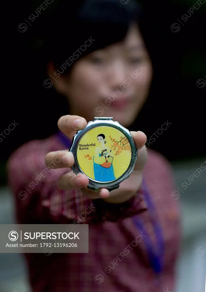 North Korea, Pyongyang District, Pyongyang, Woman Showing A Make Up Box