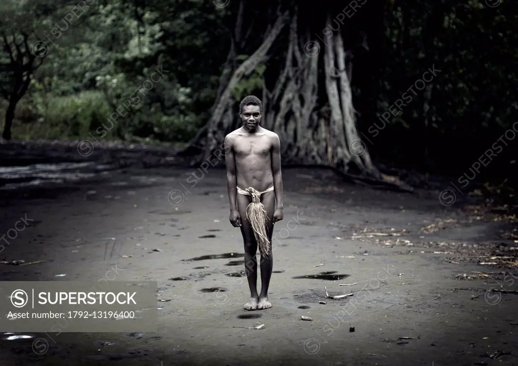 Vanuatu, Tafea Province, Tanna Island, teenager standing in the middle of the ceremonial square