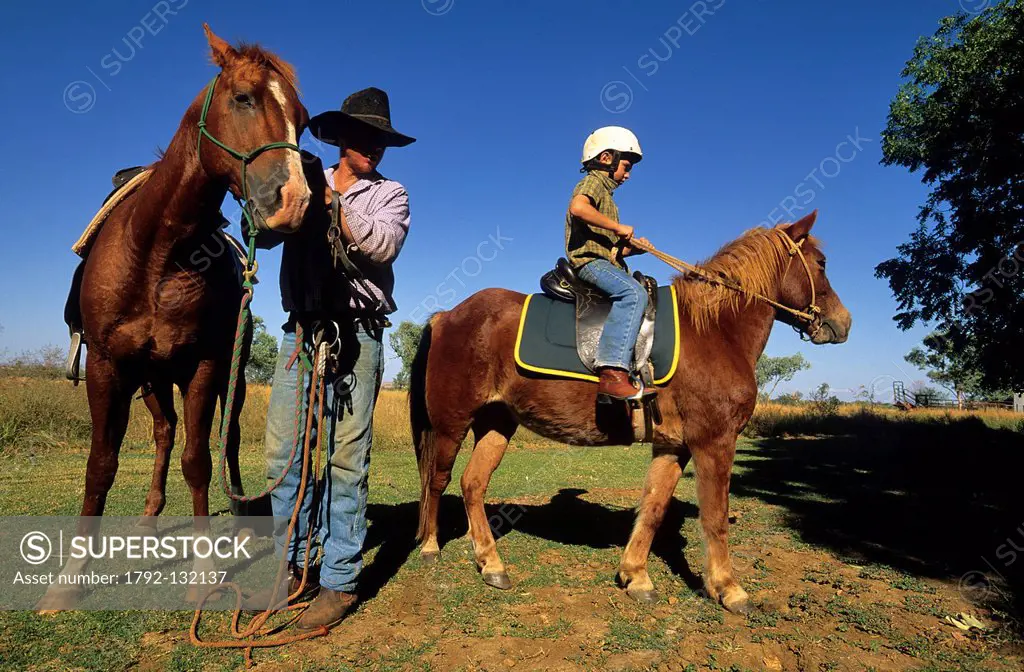 Australia, Western Australia, Kimberley Region, Mornington Wildlife Sanctuary, Bluey Cook and his son David on horses