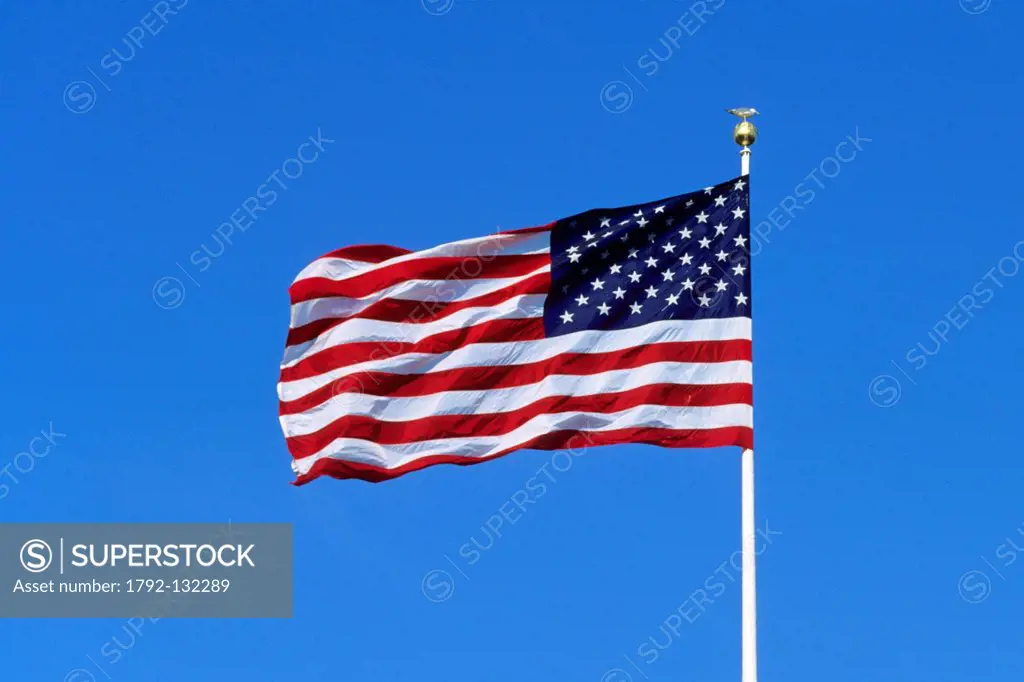 United States, New York City, Liberty Island, American flag in the wind