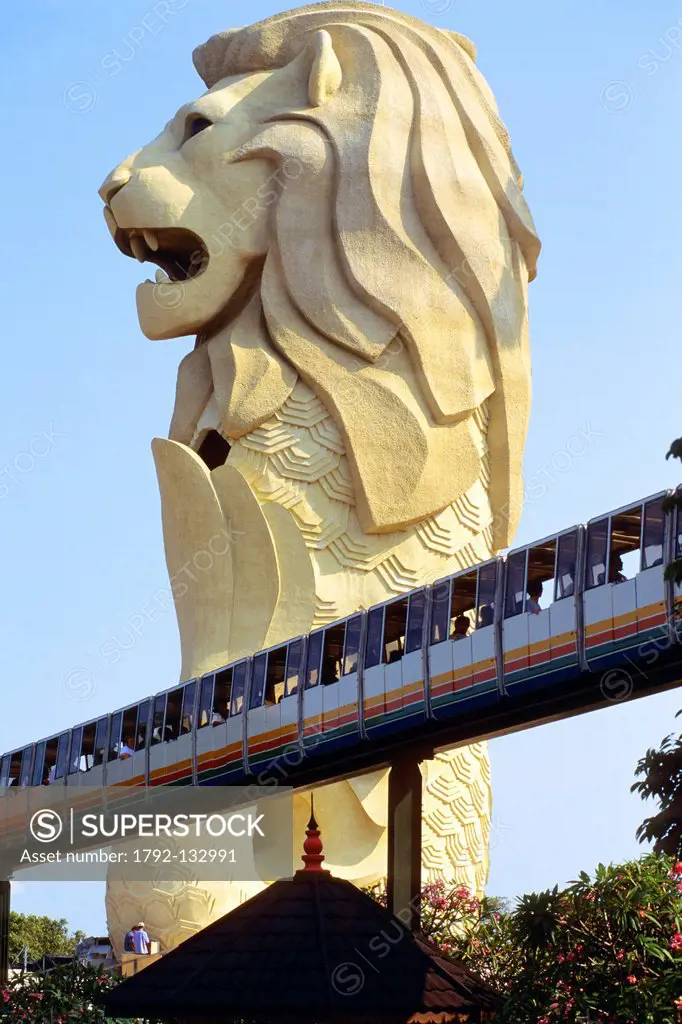 Singapore, Sentosa island, the famous and giant Merlion statue with lion head and fish body which is the emblem of Singapore in front of which passes ...