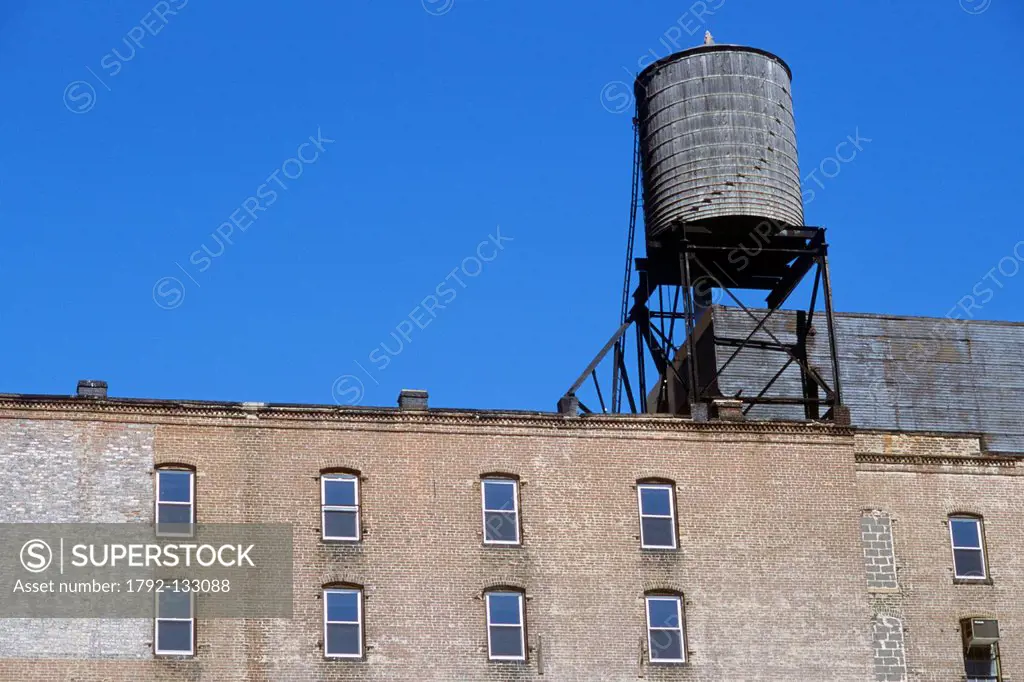 United States, New York City, Manhattan, characteristic water tank build with wooden planks on the roofs of buildings in New York