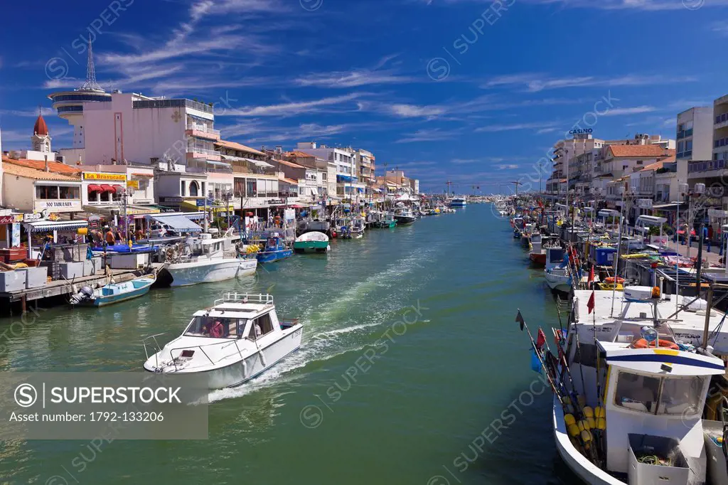 France, Herault, Palavas Les Flots, the canal which connects Lez coastal river with the sea and the former water tower converted into the Phare de la ...