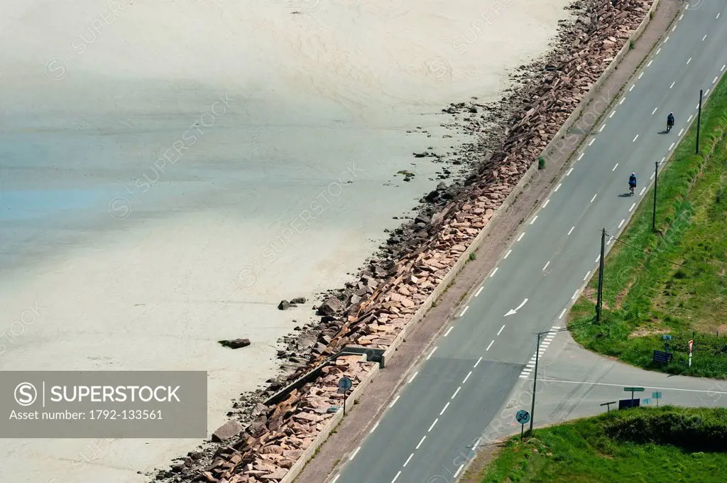France, Cotes d´Armor, Plestin les Greves, cyclists on the coastal road along the shore of St. Michel