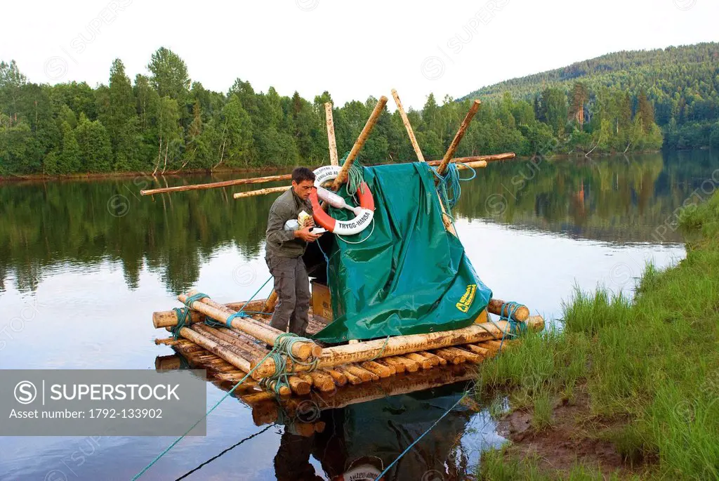 Sweden, Central area, Varmland County, timber raft boat on Klaralven river between villages of Stollet and Ederback