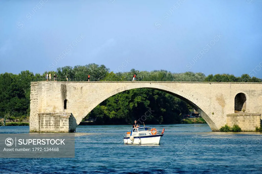 France, Vaucluse, Avignon, Pont d´Avignon listed as World Heritage by UNESCO, passage of a motor boat on the Rhone