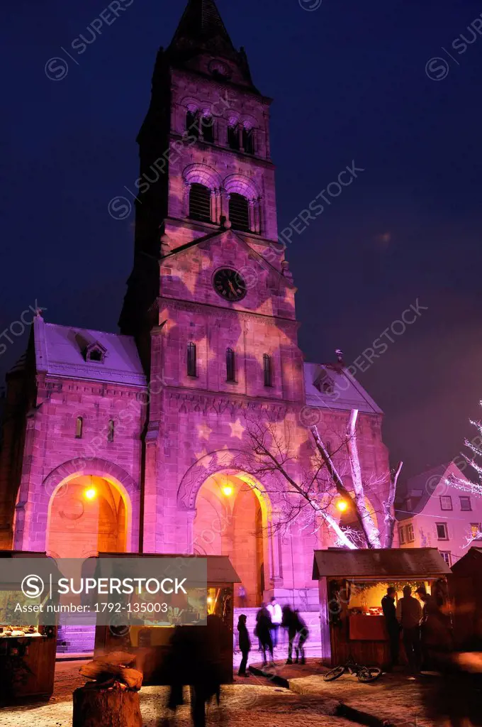 France, Haut Rhin, Munster, Market Square, Bredlamarik or Christmas market in front of the Protestant church, illuminations, December