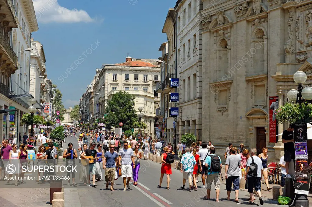 France, Vaucluse, Avignon, Rue de la Republique, Avignon Festival, festival goers loitering in the middle of the street