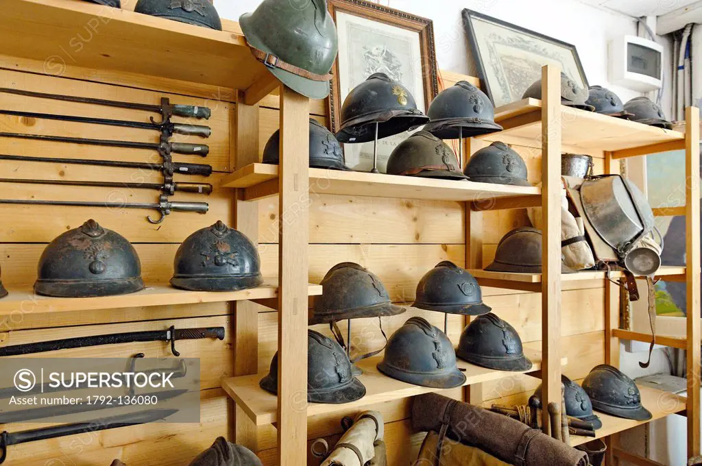 France, Meuse, Verdun, La Tranchee Du Poilu, specializing in antique objects of the first war, shelf with French bayonets and helmets