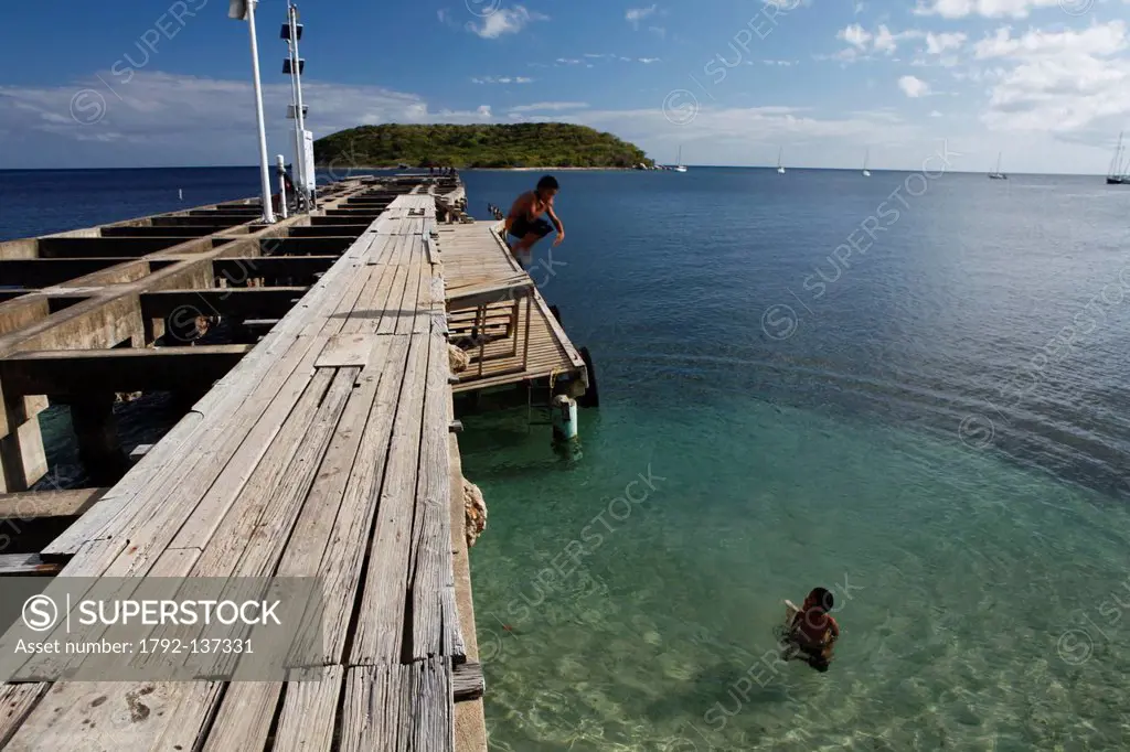Puerto Rico, Vieques Island, small town of Esperanza, children bathing in the sea