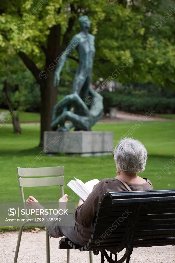 France, Paris, woman reading on a bench in the Jardin du Luxembourg  Luxembourg gardens