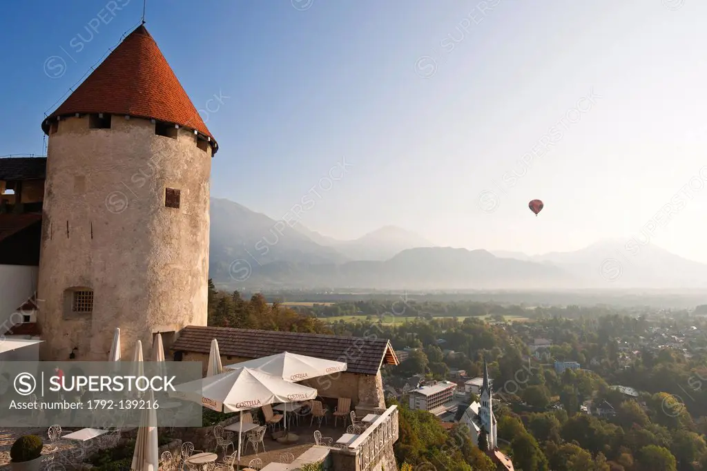 Slovenia, Gorenjska Region, Bled, hot air balloon flight over the castle_museum and the Julian Alps in the background