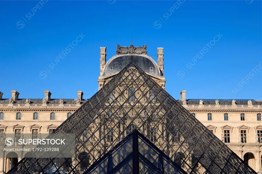 France, Paris, the pyramid of the Louvre by architect Ieoh Ming Pei, the Richelieu Wing in the Cour Napoleon