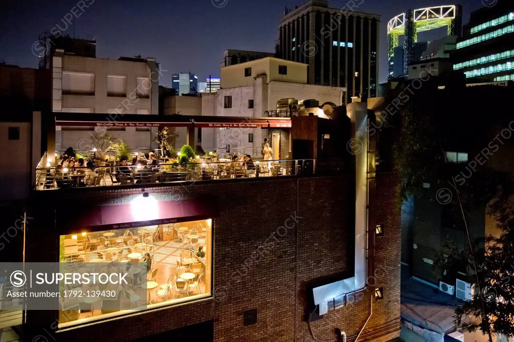 South Korea, Seoul, Insadong District, night view of a rooftop cafe with Jongno Tower in the background