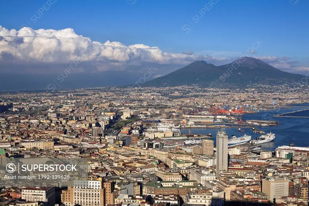 Italy, Campania, Naples, view over the Historic center listed as World Heritage by UNESCO, Mount Vesuvius and the harbour from San Martino Charterhous...
