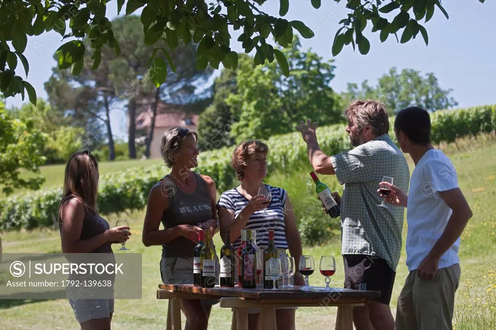France, Lot, Parnac, tasting at the property with the winemaker Bernard Bouyssou, Chateau Armandie re AOC Cahors has a dock or boats that are moored r...