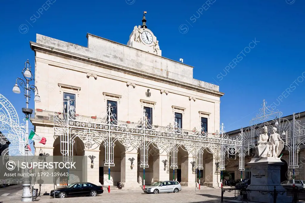 Italy, Puglia, Lecce province, Maglie, Aldo Moro square, townhall dating 19th century with statue dedicated to Francesca Capece village benefactor and...