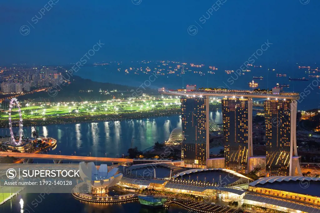Singapore, Marina Bay, view from the 1_Altitude bar over the Marina Bay Sands Hotel, opened in 2010, and designed by architect Moshe Safdie for 4.5 bi...